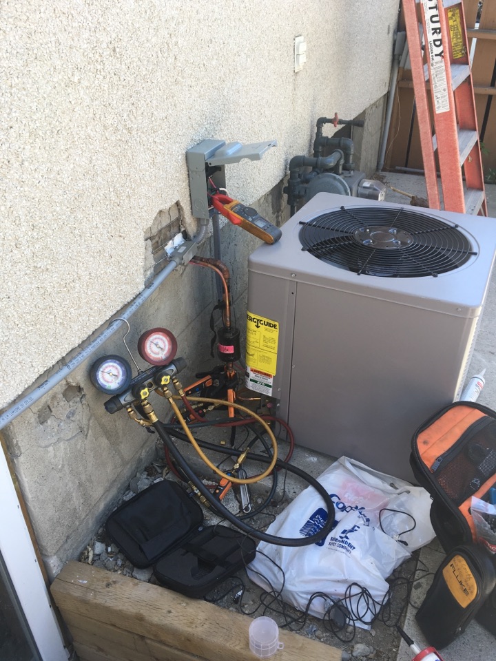 Arbour Lake, AB - Installing 2.4 ton condenser  Arbour Lake, AB - Installing 2.4 ton condenser